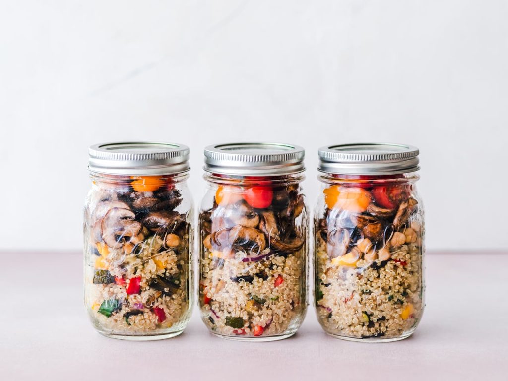 Three Mason Jars Inlined on White Surface